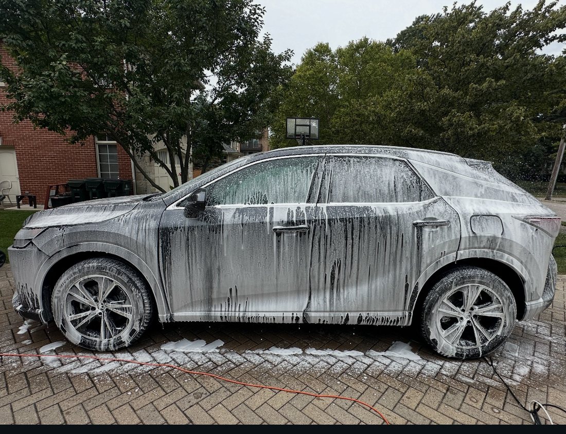 Foam cannon wash on a Lexus RX in a Chicago driveway